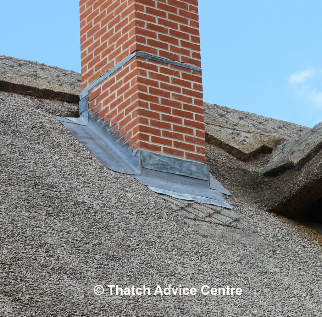 Brick Chimney with lead flashing in thatched roof